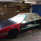 Painting the car, complete with the crunched fender from the red car installed.